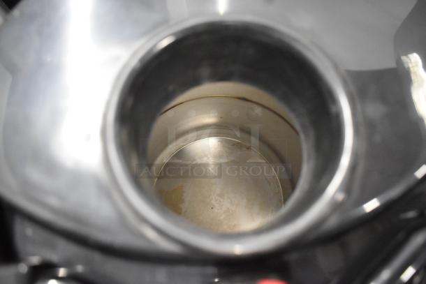 3 Fetco metal countertop beverage dispensers in used condition, showing interior view. Suitable for cafes or catering.