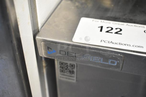 2020 Delfield 406P-STAR2 stainless steel undercounter cooler, single door, on commercial casters, 115V, 1 phase, PCI label visible.