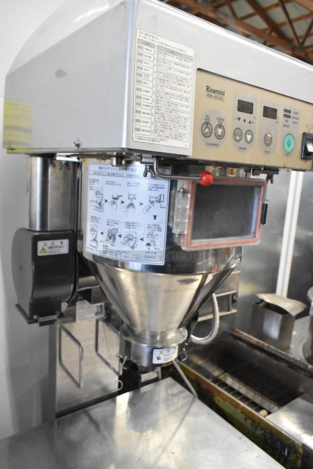 Ricemini RM-401A rice washing machine, 100V, 1-phase. Features control panel, instructional labels. Commercial use.