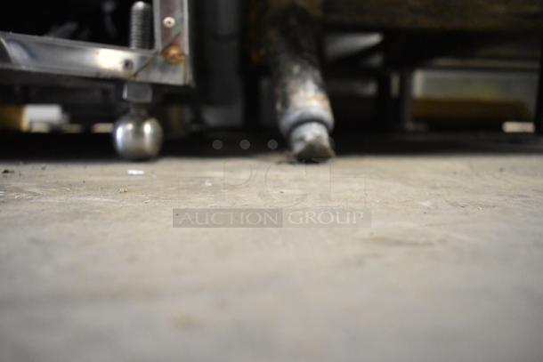 Dean SR42GN stainless steel commercial fryer, natural gas, floor style, 105,000 BTU, visible legs and piping.