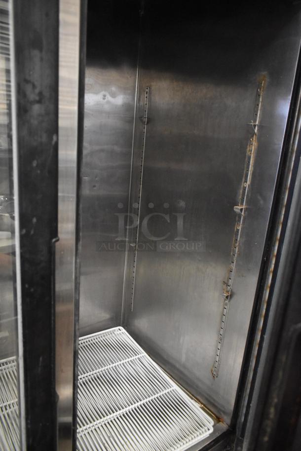 Atosa MCF8707 stainless steel commercial cooler interior, featuring poly coated racks and commercial casters. Clean condition.