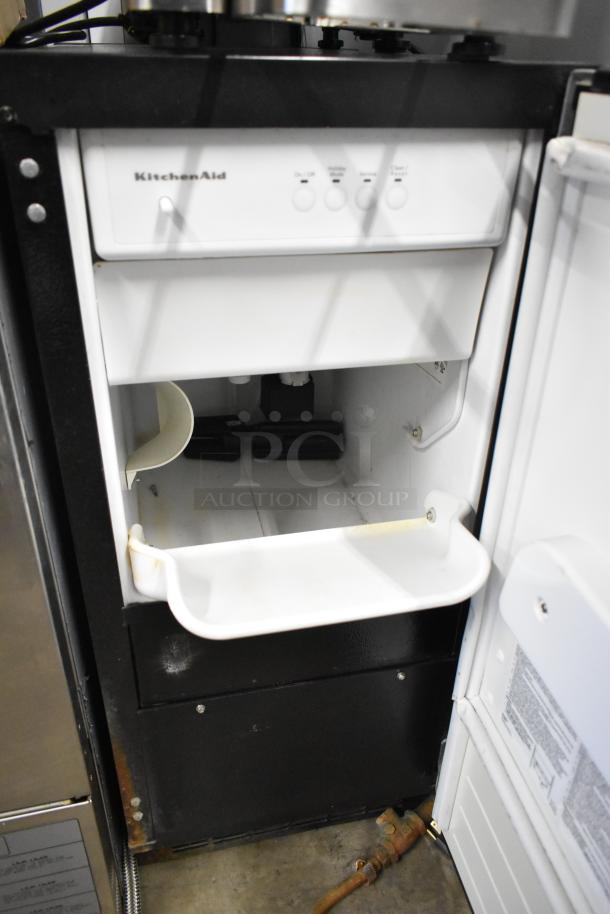 KitchenAid KUIC15PRTS0 stainless steel ice machine, 115 volts, 1 phase. Features front control panel, visible wear.