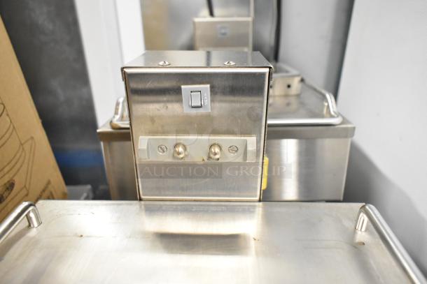 Bunn 1SH STAND stainless steel commercial server stand, 120V, 1 phase. Features a switch and 4 AMP label. Good condition.