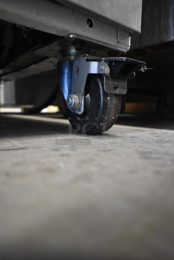 Arctic Air R22CWF6 cooler caster, sturdy metal, swiveling design for mobility on commercial casters.
