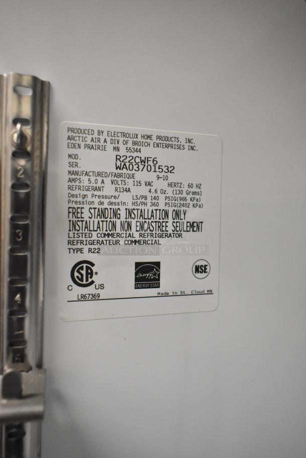 Arctic Air R22CWF6 metal single door reach-in cooler with commercial casters, 115V, 1 phase, model details label shown.