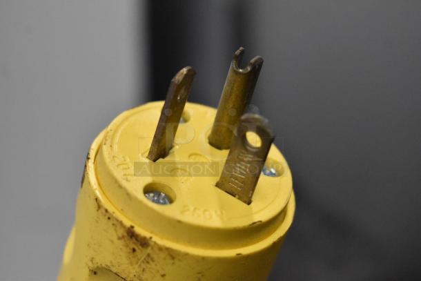Close-up of a yellow electrical plug for the 2017 Techfrico Microgel 4 refrigerated display case, 230 volts.