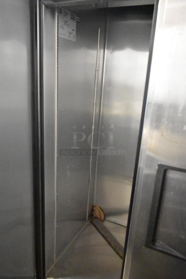 2017 True T-35 stainless steel commercial cooler interior, features two doors, 115V, 1 phase, model T-35, visible label.