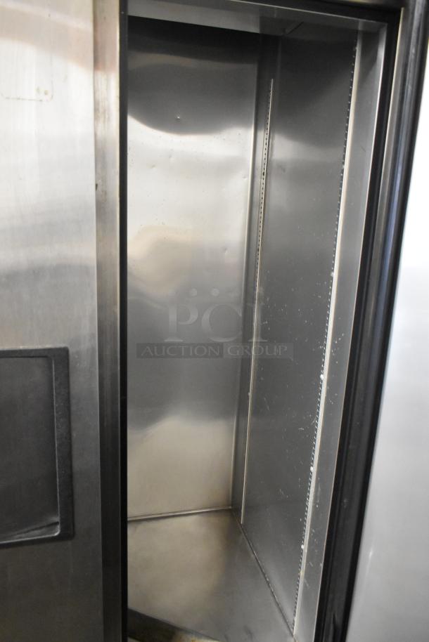 2017 True T-35 Stainless Steel 2 Door Reach-In Cooler, 115 Volts, 1 Phase, commercial use, interior view, good condition.
