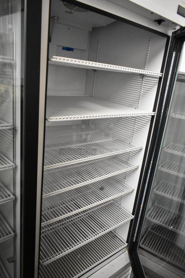 2021 True TSCI-600R-G-PH single door cooler merchandiser, metal frame, poly coated racks, 115V, excellent condition.