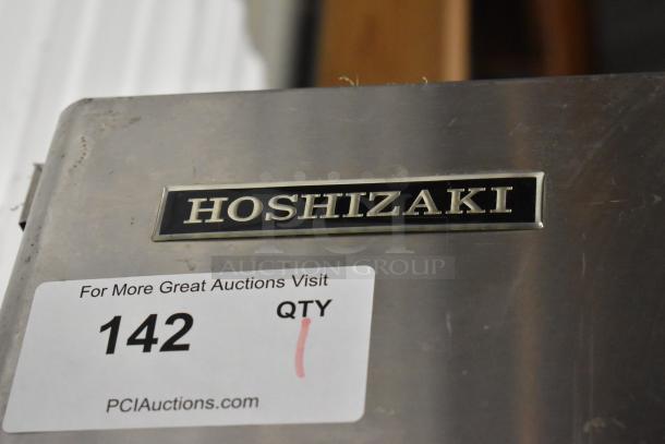Hoshizaki KM-501MWH stainless steel ice machine, visible label reading "Hoshizaki," auction tag "142, QTY 1." 115V, 1 phase.
