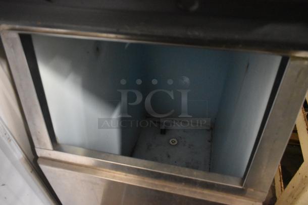 Hoshizaki KM-501MWH stainless steel ice machine head on commercial bin, 115 volts, 1 phase, clean interior.