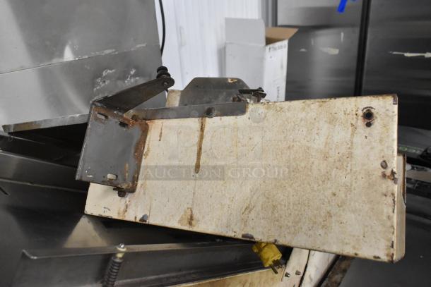 Mimax Metal Commercial Bread Loaf Slicer, floor style, visible wear, 115 volts, 1 phase. Rust on metal parts.