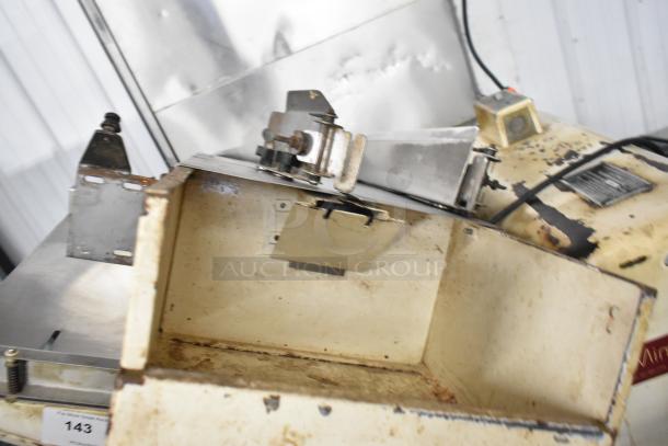 Mimax Metal Commercial Bread Loaf Slicer, floor style, 115 volts, 1 phase. Visible wear, metal construction, auction tag #143.