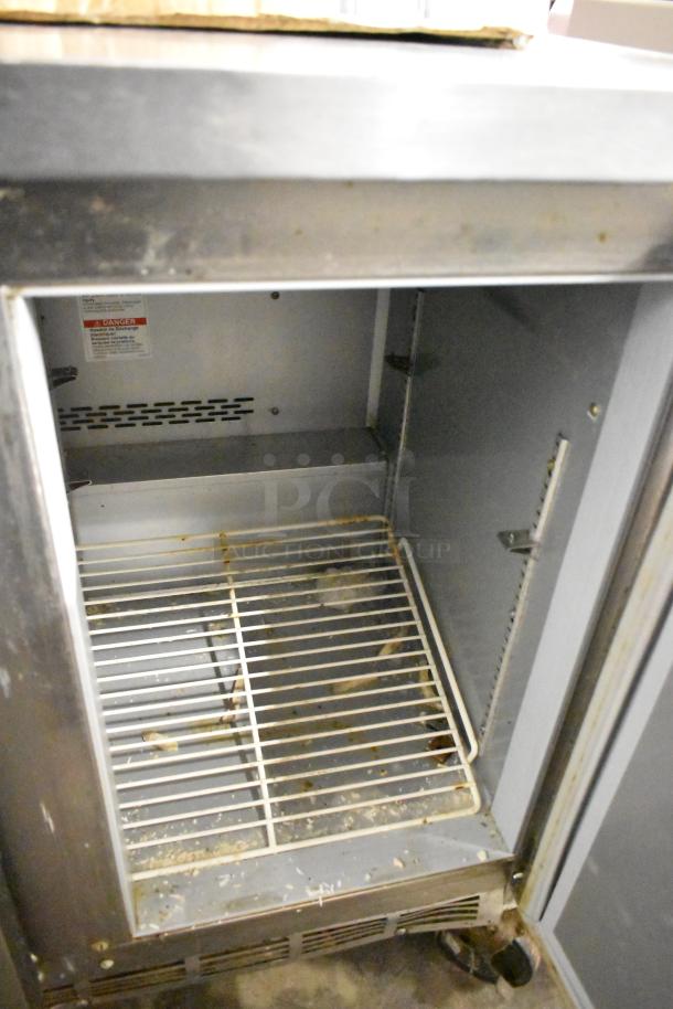 Beverage Air WTF36AHC stainless steel undercounter freezer on commercial casters, two doors, 115 volts, interior view.