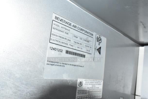 Beverage Air WTF36AHC commercial undercounter freezer, stainless steel, 2 doors, on casters. Label shows 115V, 1 phase, R290 refrigerant.