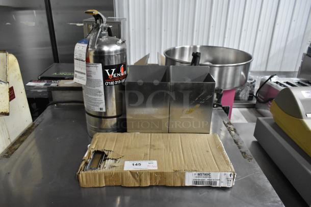 Fire extinguisher with label, WST969C divider kit in box, metal bins, on stainless surface. Pickup required.