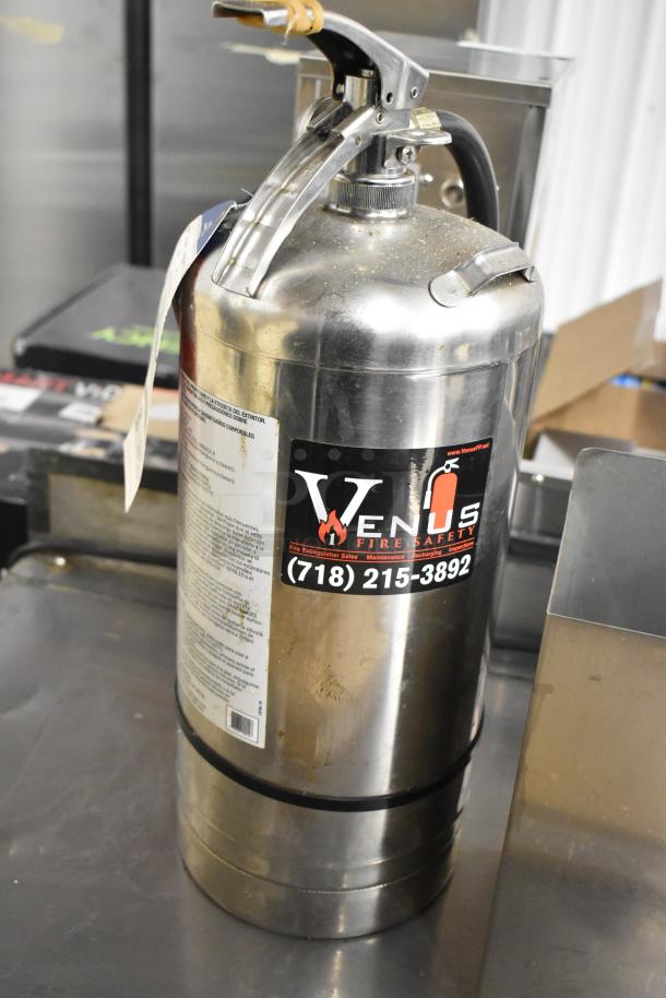 Venus fire extinguisher, metal body, includes safety label and contact info. Local pickup required, not for shipping.