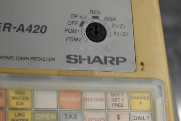Sharp ER-A420 countertop cash register, visible control dial and colorful keys, signs of wear, model label included.