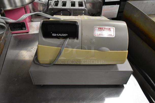 Sharp ER-A420 countertop cash register with visible wear. Pro-Tech label on top indicating model support.