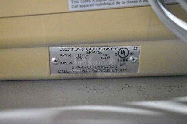 Metal label on Sharp ER-A420 cash register showing model number, electrical rating, and serial number. Made in China.