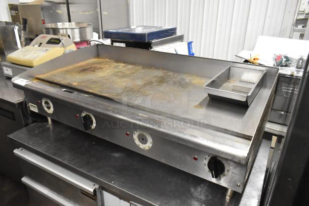 Toastmaster Pro Series stainless steel electric flat top griddle, thermostatic controls, commercial use, moderate wear.