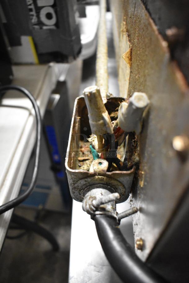 Toastmaster Pro Series griddle with visible internal wiring and rust, showing wear. Model features thermostatic controls.