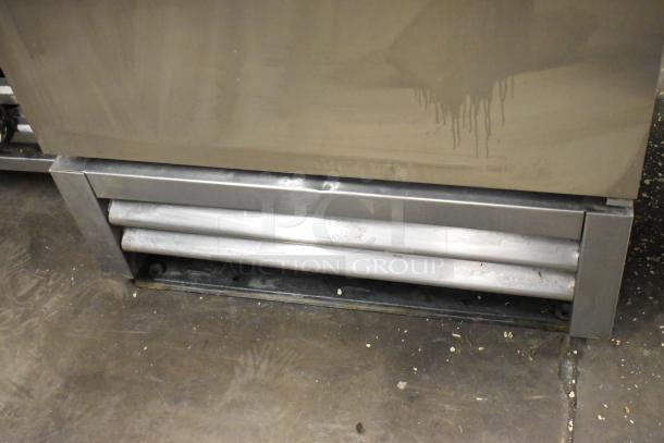 2017 True T-19F stainless steel commercial freezer, single door, with poly-coated racks, 115V, 1 phase, minor wear visible.