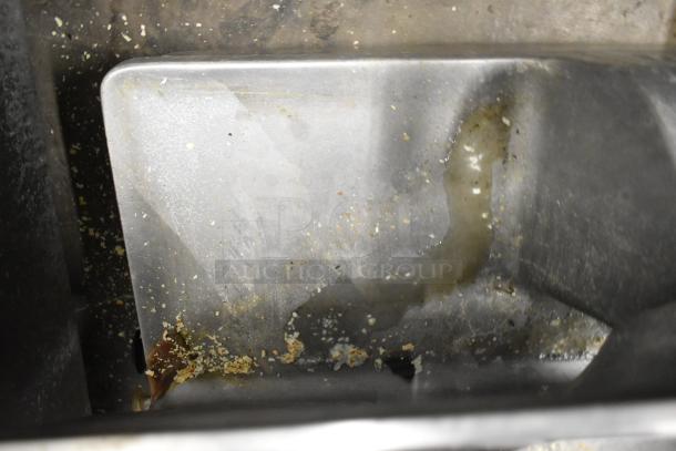 Hobart 1712 metal commercial meat slicer, visible wear and debris, 115 volts, 1 phase, countertop model.