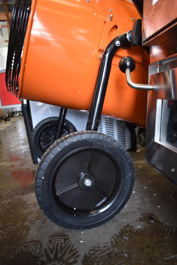 Brand new Boltic SHAG-K07P electric salamander heater, orange steel body, with robust wheels, minor scratches.
