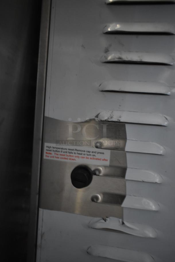 Stainless steel panel of Avantco 177DPO18DD oven, showing high temperature reset instructions. Unit is scratch and dent condition.