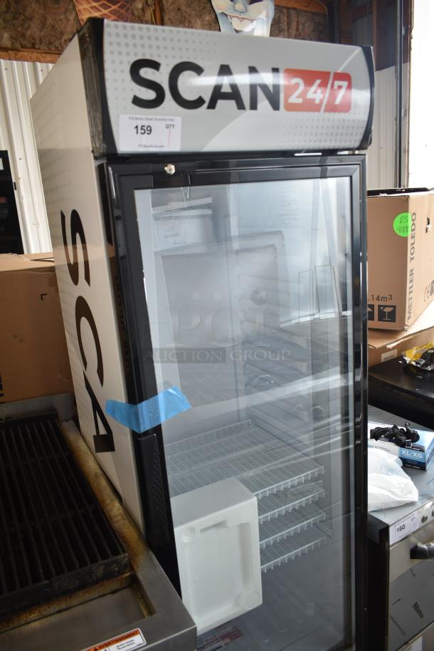 Brand new KoolMore MDR-9CP metal single door cooler with poly coated racks, 115V, minor scratches, visible auction label.