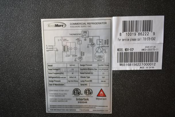 Label of KoolMore MDR-9CP cooler, showing model, voltage, refrigerant, design pressure, and certification details.