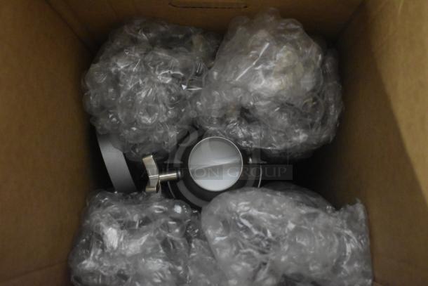 Hatco metal unit in cardboard box, surrounded by bubble wrap. Scratch and dent condition, appears unused.