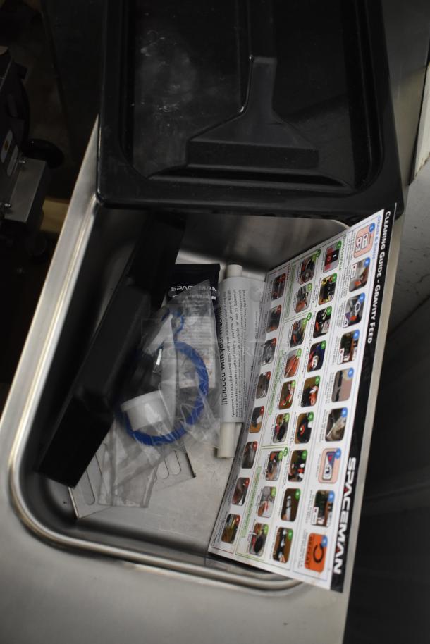 Spaceman 6210-C soft serve machine, stainless steel, gravity-fed, single flavor, 110V, with cleaning guide and parts.