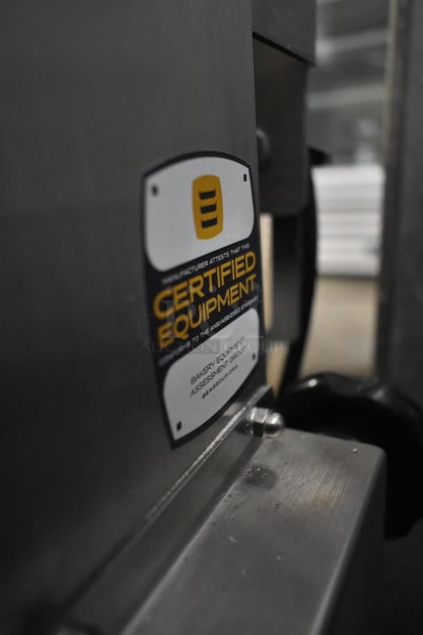 Brand new Somerset CDR-250 stainless steel dough moulder, certified equipment label visible, slight scratch and dent.