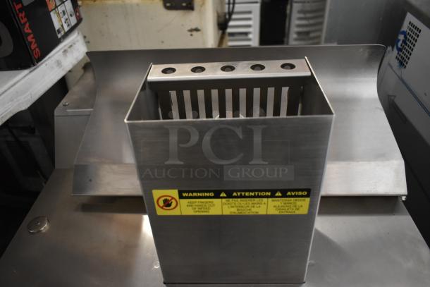 Brand new Somerset CDR-250 dough moulder; stainless steel; countertop; rolls 6-20" loaves; 115V, 1 Phase; caution label visible.