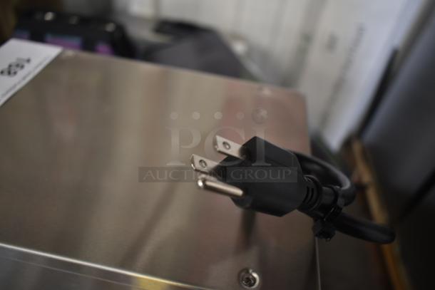 Stainless steel Avantco 177HWDA2 hot water dispenser, 120V, 1 phase, 2-gallon capacity, power cord shown, minor scratches.