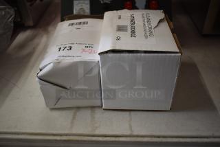 2 brand new boxes including Shurtape film tape 8-pack and Noble Eco Enzo-Kleen 64-case. Some minor dents visible.