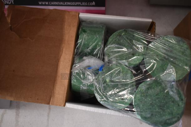 Box of new Shurtape cellulose film tape rolls and Noble Eco Enzo-Kleen grease trap blocks in original packaging.