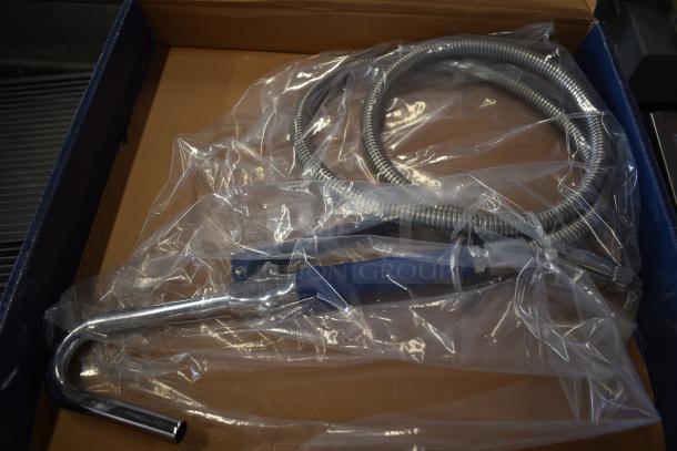 Brand new Waterloo pot and glass filler assembly, model 750PKFH68, shown in box with protective plastic. Includes hose. Slightly scratched.
