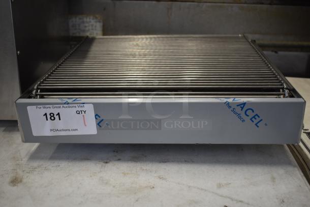 Brand new scratch and dent stainless steel conveyor attachment, grill design, with visible auction tag marked 181.