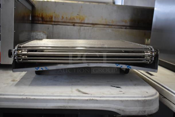 Brand new stainless steel conveyor attachment with minor scratches and dents, perfect for industrial use.