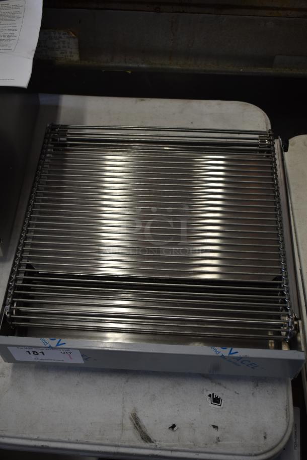 Brand new stainless steel conveyor attachment, scratch and dent condition. Model label shows minor exterior damage.