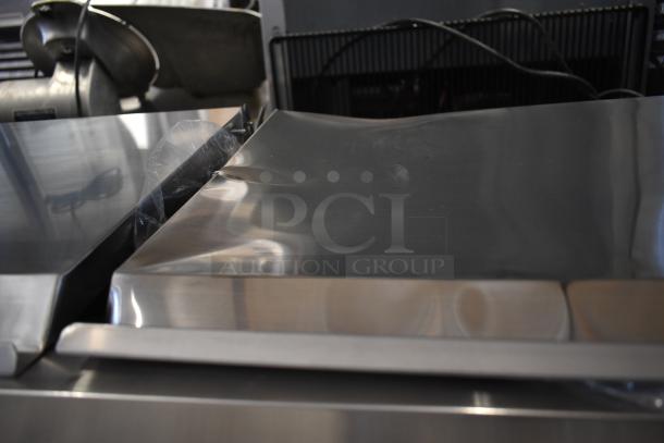 KoolMore SCDC-8P-SSL stainless steel prep station, brand new with dents. Eight pan refrigerated countertop, 115 volts, 1 phase.