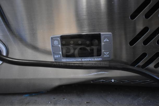 KoolMore SCDC-8P-SSL refrigerant panel with Copeland branding, stainless steel surface.