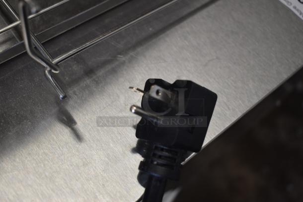 Brand new Avantco 184T3600D conveyor toaster plug on stainless steel surface; commercial use, minor scratches visible.