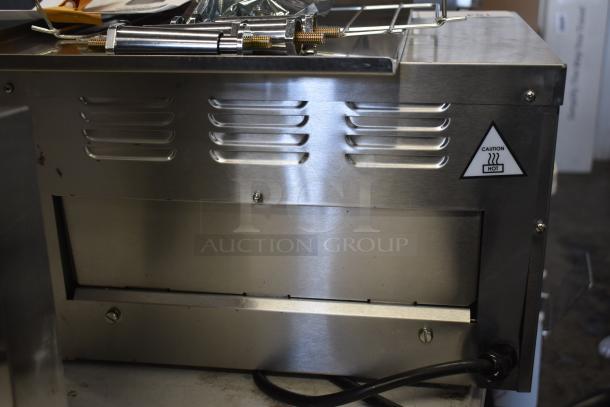 Brand new Avantco 184T3600D stainless steel conveyor toaster, 14.5" wide, with 3" opening. Scratch and dent model. Caution hot label visible.