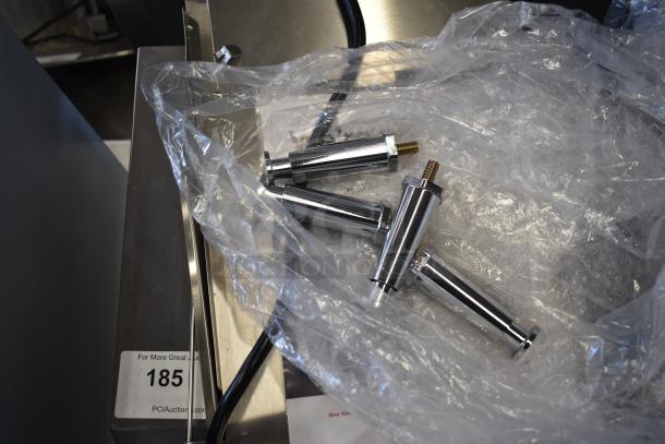 Stainless steel parts, likely conveyor related, packaged in plastic on Avantco 184T140 toaster. Marked with auction label "185".