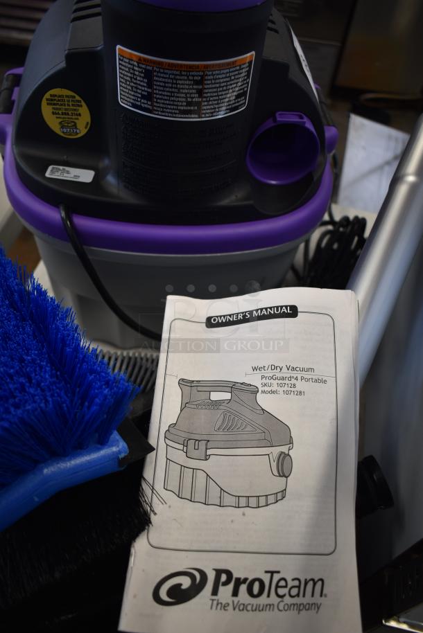 Brand new ProGuard 1071281 Wet Dry Vac, 120V, with manual. Visible tags show model and warnings. Scratch and dent condition.