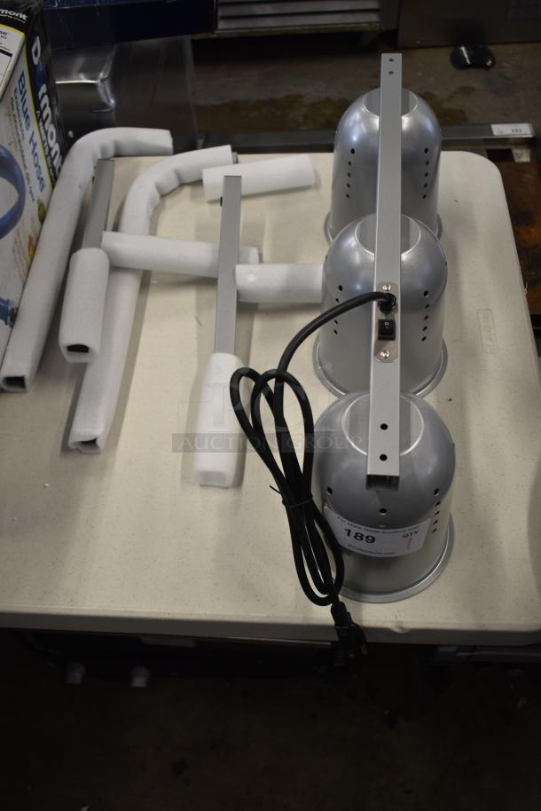 Brand new ServIt 423BLS3 3-bulb heat lamp, scratch and dent. Includes power cord. 120V, 1 phase.